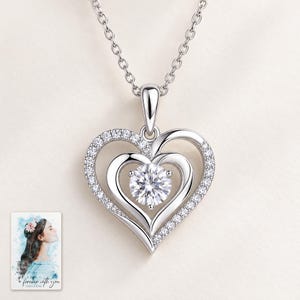 Double Heart Moissanite Necklace, shown against a light background. A sample personalized digital greeting card is shown alongside.