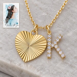 K Initial Heart Necklace, macro detail view. A personalized digital greeting card is shown alongside.
