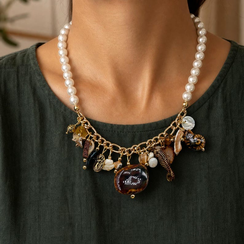 Three-piece handmade necklace set featuring bronze and brown beaded necklace, gray and brown beaded necklace and silver and bronze beaded necklace, displayed together to show the coordinated colors and beadwork