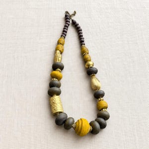 Red beaded necklace with colorful teardrop focal beads from the four piece boho jewelry set
