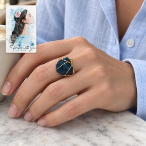 Blue Wire Wrapped Ring, human lifestyle view. A personalized digital greeting card is shown alongside.
