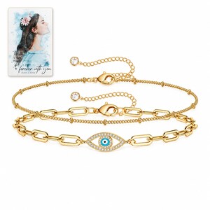 Gold Tone Evil Eye Bracelet Duo shown on a clean white catalog background for an unobstructed product view. A personalized digital greeting card is shown alongside.