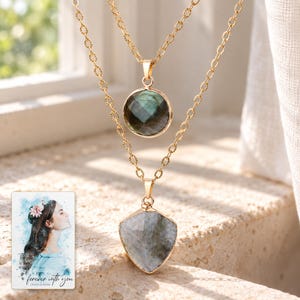 Layered Shield Necklace, sunlit home view. A personalized digital greeting card is shown alongside.