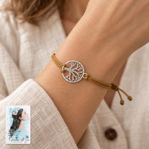 Tree of Life Cord Bracelet, worn by an adult. A sample personalized digital greeting card is shown alongside.