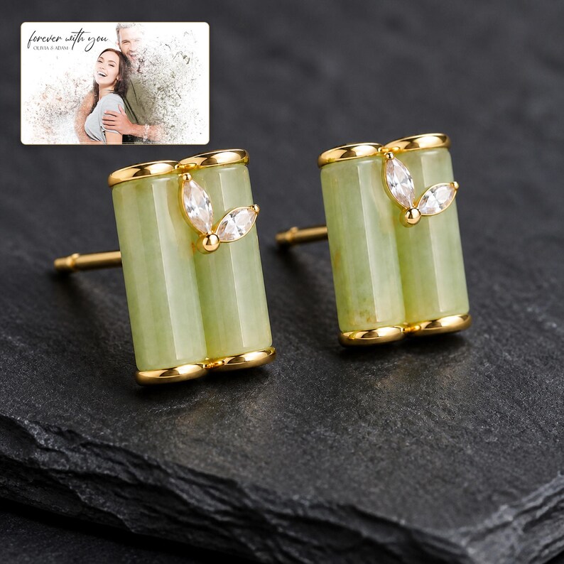 Pale green bamboo-shaped stud earrings with gold-tone edges, dark-bordered product view. A personalized greeting-card example appears in the corner.