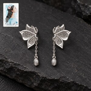 Butterfly Drop Earrings, shown against a dark background. A sample personalized digital greeting card is shown alongside.
