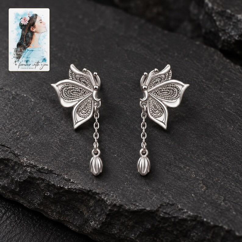 Butterfly Drop Earrings, shown against a dark background. A sample personalized digital greeting card is shown alongside.
