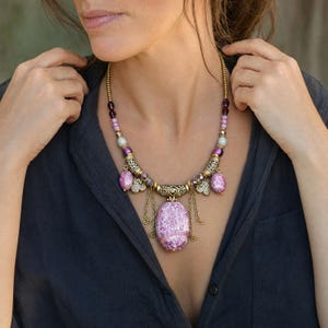 Three-piece handmade necklace set featuring silver and gray beaded necklace, silver and gray beaded necklace and silver and gray beaded necklace, displayed together to show the coordinated colors and beadwork