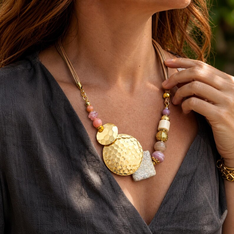 Three-piece handmade necklace set featuring bronze and beige beaded necklace, silver and bronze beaded necklace and brown and bronze beaded necklace, displayed together to show the coordinated colors and beadwork