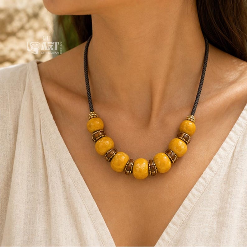 Gift box and close-up detail photo of mustard yellow beaded boho statement necklace for handmade jewelry gifting