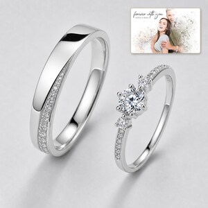 First Sight 925 Promise Rings shown during a warm gift-receiving moment between adults with the exact jewelry visible.