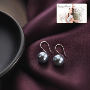 pearl-look beads Poise Earring Collection styled for an elegant evening look with the product remaining the clear focal point.