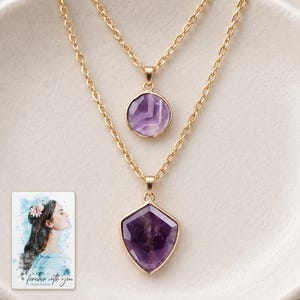 Layered Shield Necklace, macro detail view. A personalized digital greeting card is shown alongside.