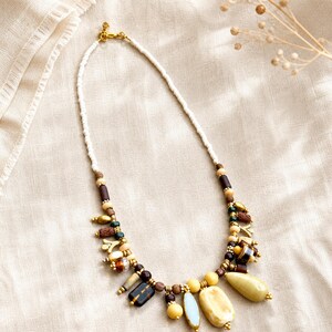 Gift ready presentation of Clear and Beige Statement Beaded Necklace, Boho Handmade Jewelry, Artisan Gift for Her in an open jewelry box lined with natural ivory linen