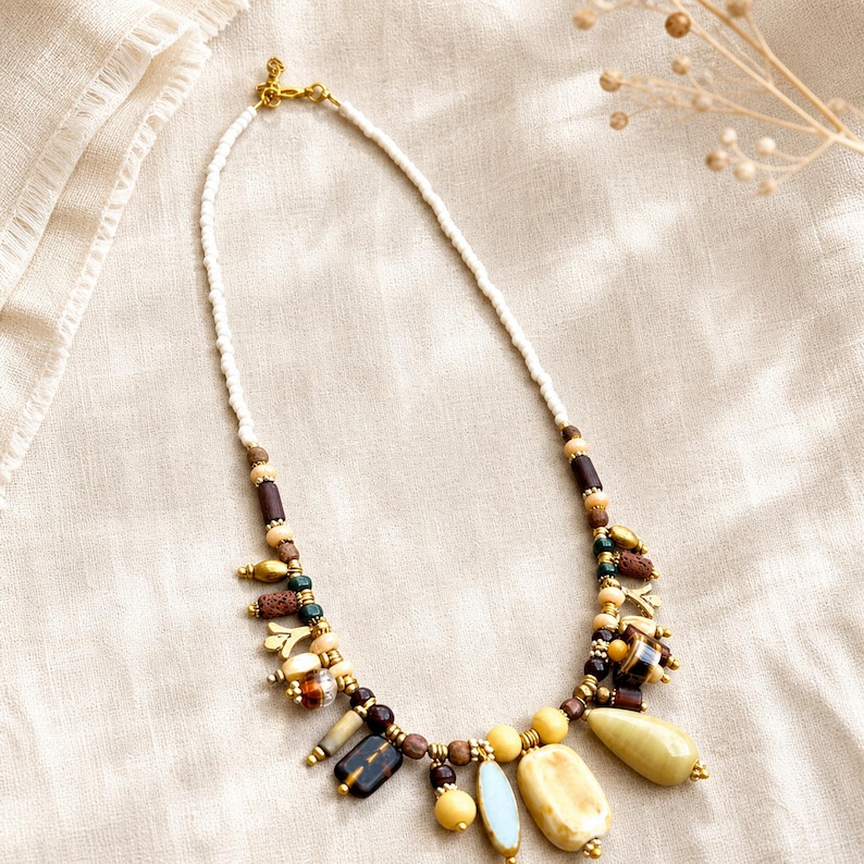 Gift ready presentation of Clear and Beige Statement Beaded Necklace, Boho Handmade Jewelry, Artisan Gift for Her in an open jewelry box lined with natural ivory linen