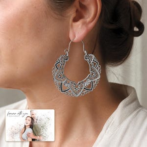 Antique Lace Boho Hoops worn by an adult in a polished evening lifestyle scene.