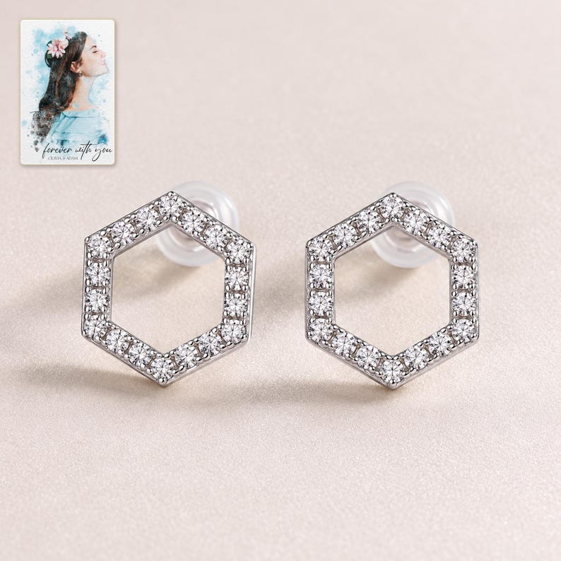 Hexagon Moissanite Stud Earrings, shown against a light background. A sample personalized digital greeting card is shown alongside.