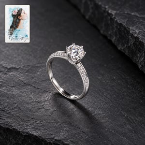 Moissanite Solitaire Ring, shown against a dark background. A sample personalized digital greeting card is shown alongside.