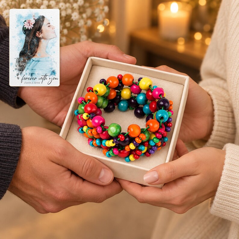 Rainbow Bead Bracelet shown during a warm gift-receiving moment between adults with the jewelry visible. A personalized digital greeting card is shown alongside.