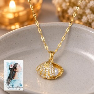 Shell Shaped Necklace, evening style view. A personalized digital greeting card is shown alongside.