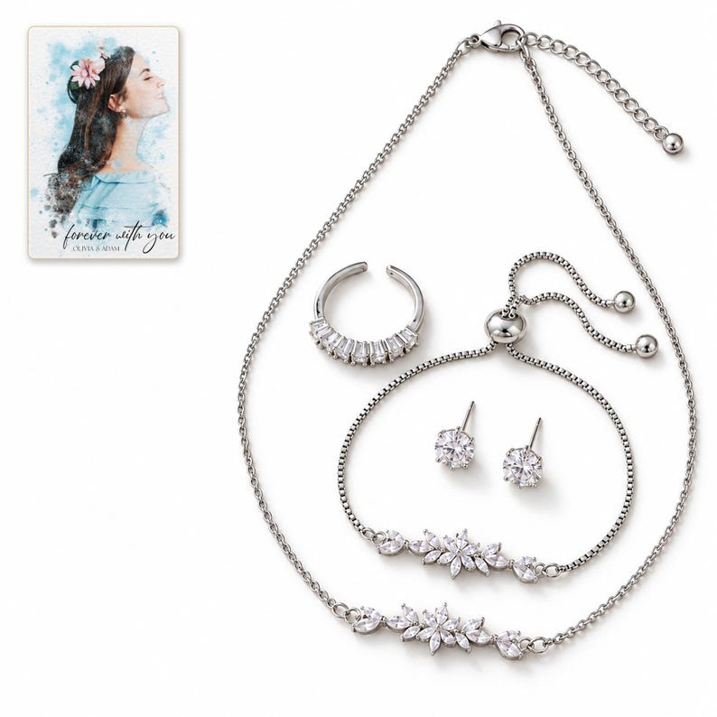 White-background catalog view of the floral necklace and bracelet with an open baguette-front ring and a pair of clear solitaire stud earrings. A personalized digital greeting card is shown alongside.