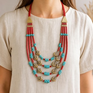 Brown and Gray Statement Beaded Necklace presented in an open jewelry gift box on natural linen