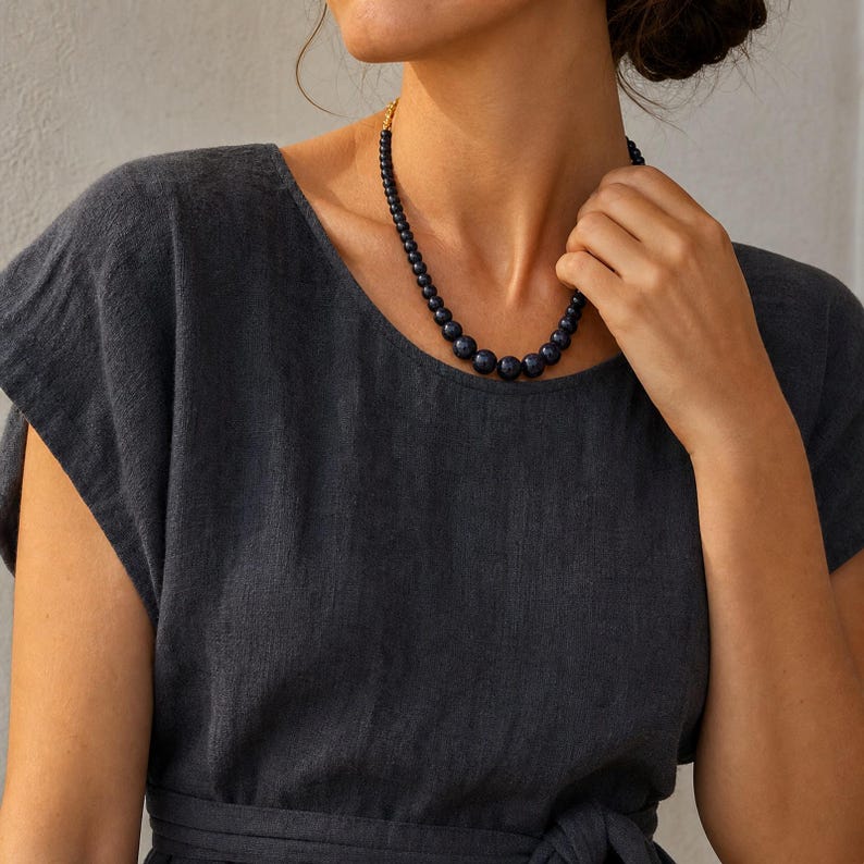 Three-piece handmade necklace set featuring gray and bronze beaded necklace, silver and gray beaded necklace and brown and bronze beaded necklace, displayed together to show the coordinated colors and beadwork
