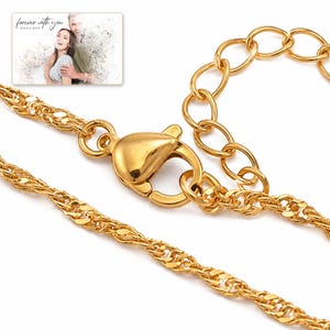 Golden Waterline Chain shown during a warm gift-receiving moment between adults with the exact jewelry visible.