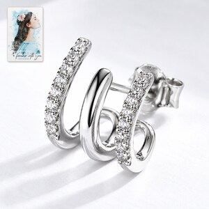 Triple Arc Stud Earrings, close-up of the details. A sample personalized digital greeting card is shown alongside.