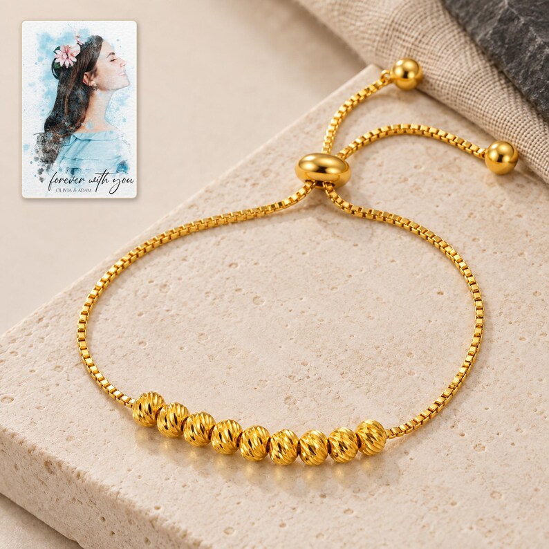 Golden Spiral Bead Slider Bracelet shown in a close macro view highlighting the visible texture, texture and construction details. A personalized digital greeting card is shown alongside.