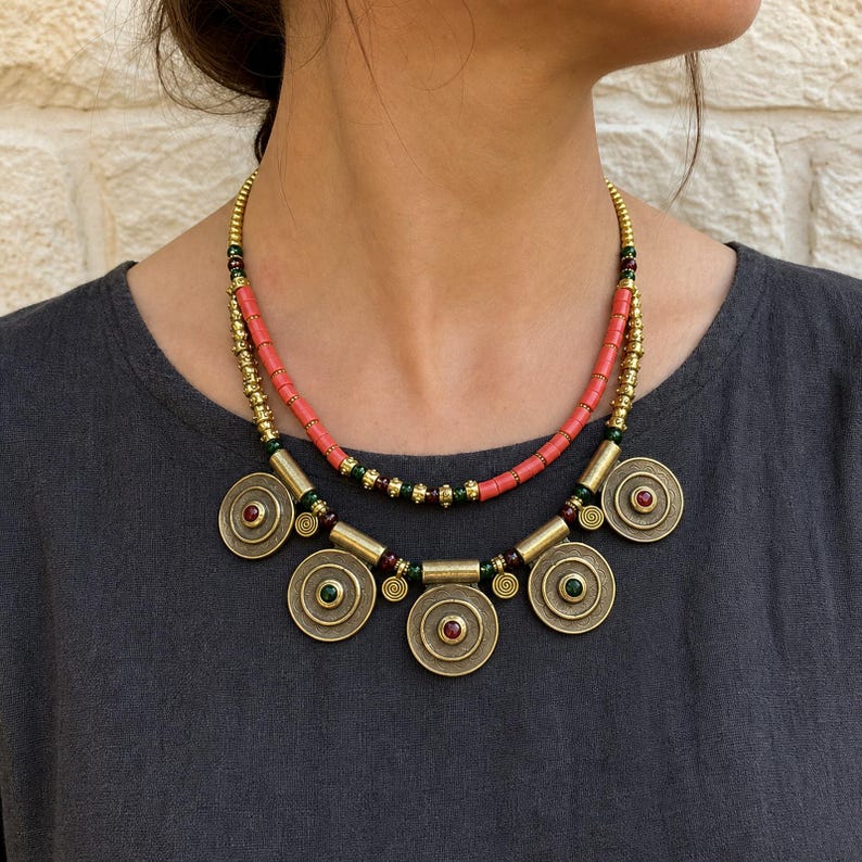 Three-piece handmade necklace set featuring brown and bronze beaded necklace, beige and brown beaded necklace and rose gold and silver beaded necklace, displayed together to show the coordinated colors and beadwork