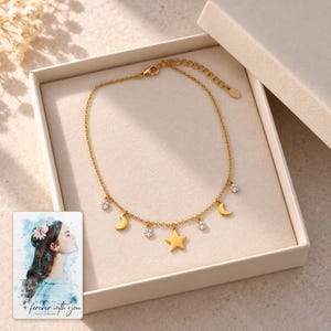 Moon and Star Necklace, displayed in a presentation box. A sample personalized digital greeting card is shown alongside.