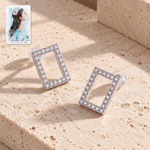 Rectangle Moissanite Stud Earrings, shown in natural light. A sample personalized digital greeting card is shown alongside.