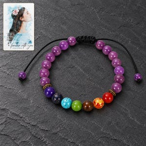 Violet Spectrum Cord Bracelet styled against a dark luxury surface with the exact product finish clearly visible. A personalized digital greeting card is shown alongside.