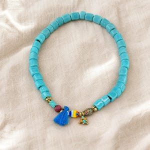 Gift ready presentation of Blue and Silver Statement Beaded Necklace in an open jewelry box lined with natural ivory linen