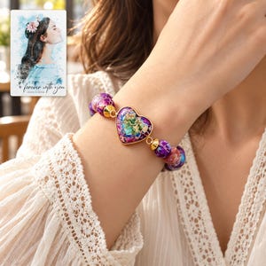 Imperial Mosaic Heart Bracelet worn by an adult in a natural daytime lifestyle scene. A personalized digital greeting card is shown alongside.