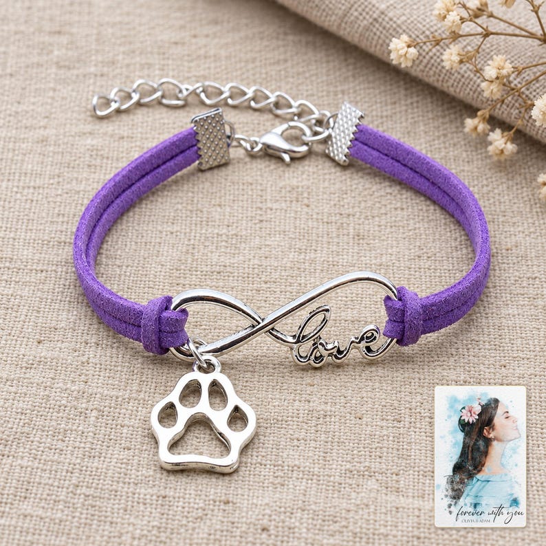 Infinity Love Paw Bracelet, laid on fabric. A sample personalized digital greeting card is shown alongside.
