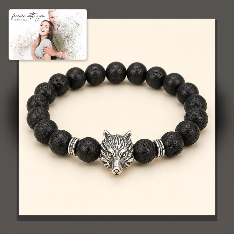 Black bead bracelet with silver-tone wolf-head detail, dark-bordered product view. A personalized greeting-card example appears in the corner.