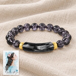 Midnight Marble Bar Bracelet arranged on soft ivory linen in a refined neutral flat lay. A personalized digital greeting card is shown alongside.