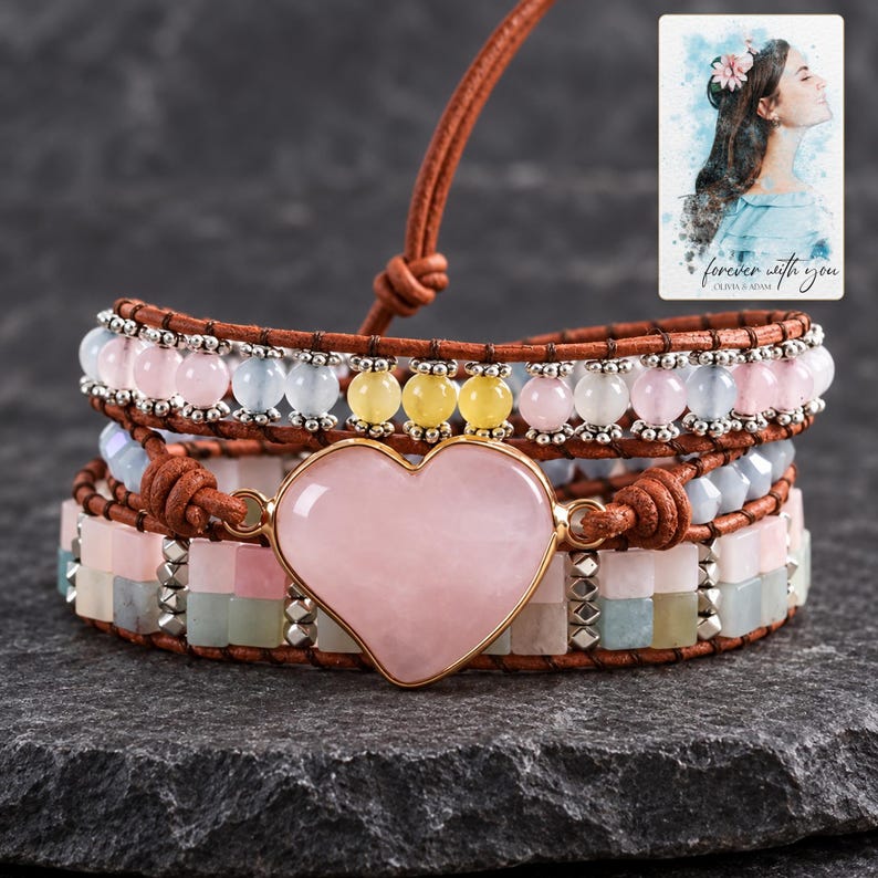 Pastel Heart Wrap Bracelet styled against a dark luxury surface with the exact product finish clearly visible. A personalized digital greeting card is shown alongside.