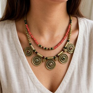 Brown and Bronze Statement Beaded Necklace presented in an open jewelry gift box on natural linen
