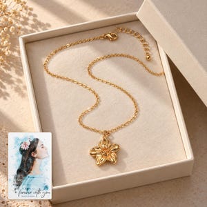 Gold Tone Flower Necklace, displayed in a presentation box. A sample personalized digital greeting card is shown alongside.