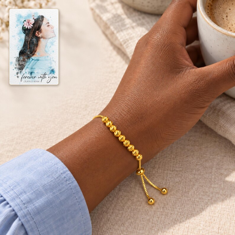 Golden Spiral Bead Slider Bracelet worn by an adult in a natural daytime lifestyle scene. A personalized digital greeting card is shown alongside.