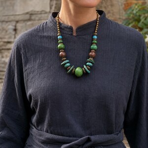 Three-piece handmade necklace set featuring rose gold and gray beaded necklace, rose gold and silver beaded necklace and rose gold and beige beaded necklace, displayed together to show the coordinated colors and beadwork