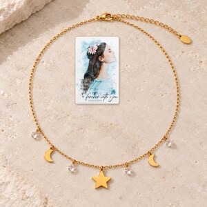 Moon and Star Necklace, shown on a display surface. A sample personalized digital greeting card is shown alongside.