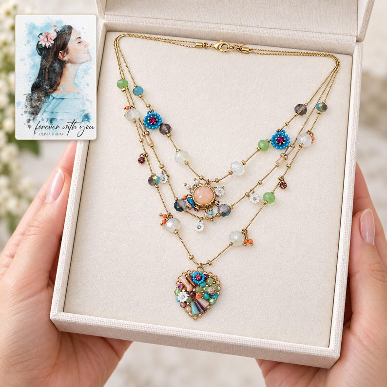 Bohemian Heart Cascade Necklace shown during a believable gift-giving moment between adults with the jewelry visible. A personalized digital greeting card is shown alongside.