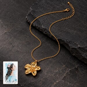Gold Tone Flower Necklace, shown against a dark background. A sample personalized digital greeting card is shown alongside.