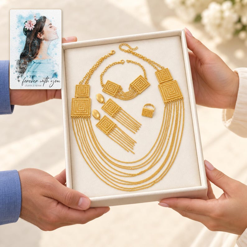 Golden Tassel Jewelry Suite shown during a believable gift-giving moment between adults with the jewelry visible. A personalized digital greeting card is shown alongside.