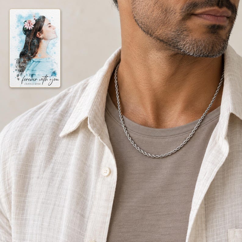 Adult man wearing a thin silver-tone rope chain with neutral linen layers. A personalized digital greeting card is shown alongside.