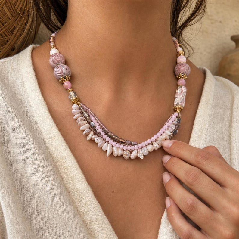 Bronze and Beige Statement Beaded Necklace, Boho Handmade Jewelry, Artisan Gift for Her displayed on a jewelry bust with the layered beadwork and pendants visible